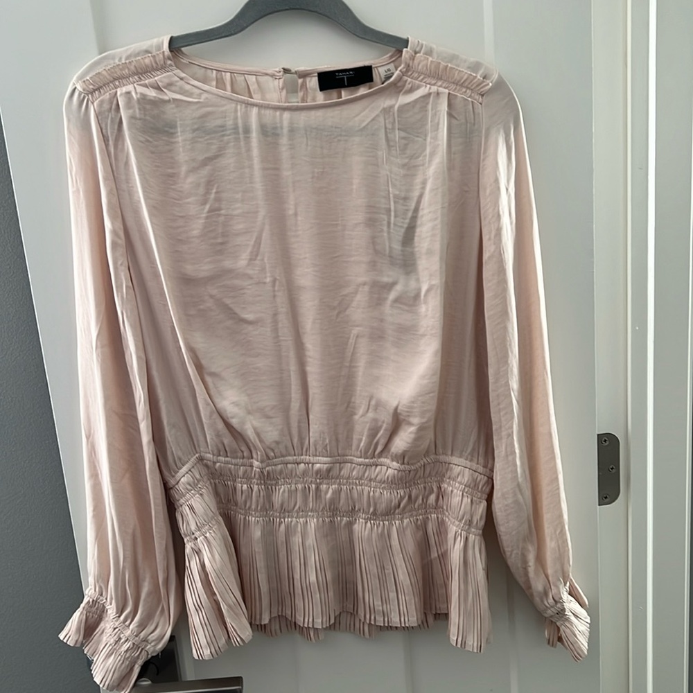 Cream blouse, with a ruffle bottom. NWT SIZE L